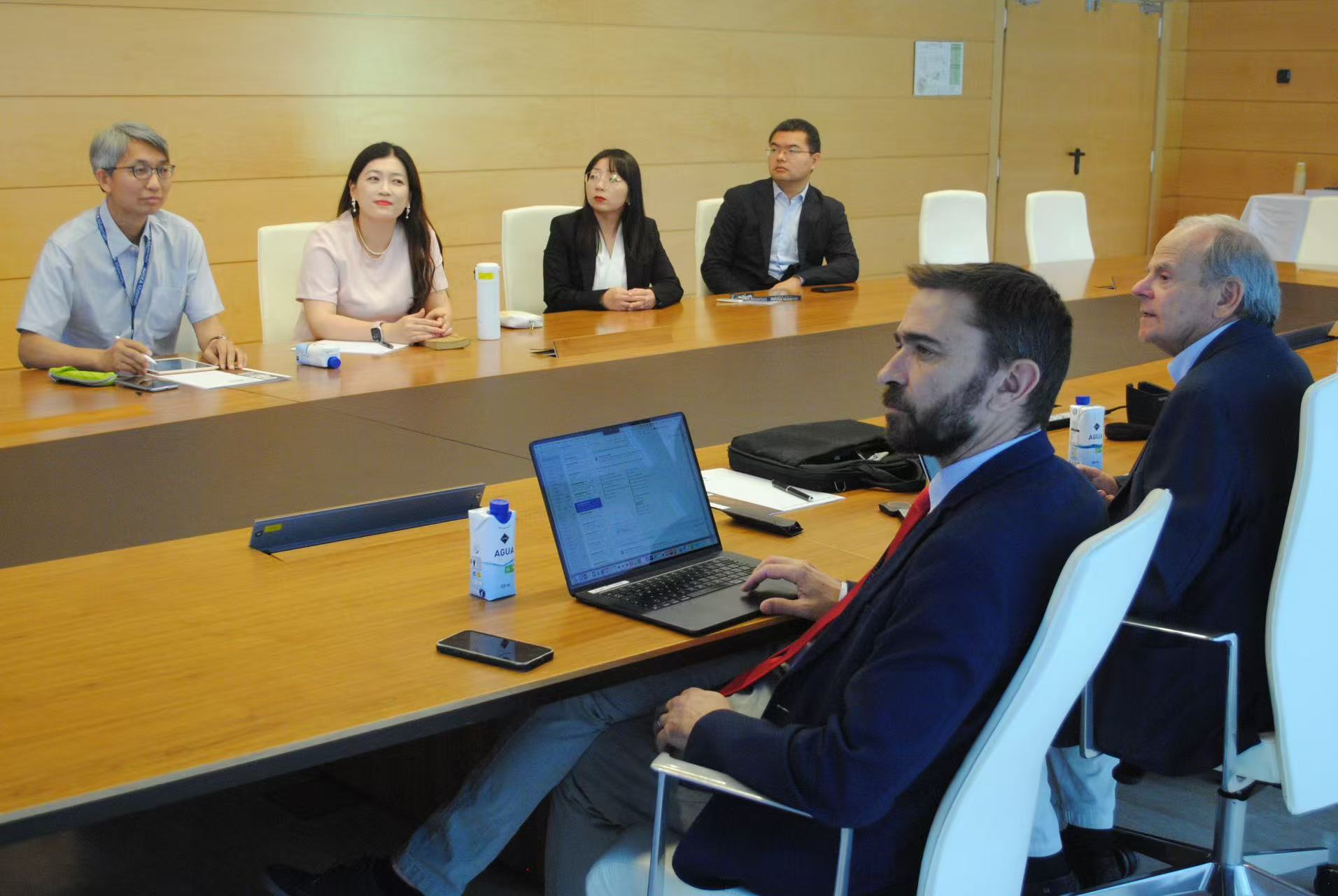 A group of people sitting at a table

Description automatically generated